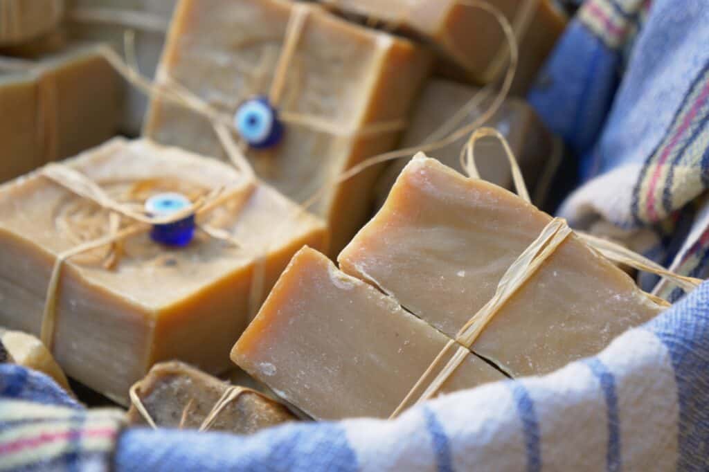 A basket of handmade organic soap bars for sale